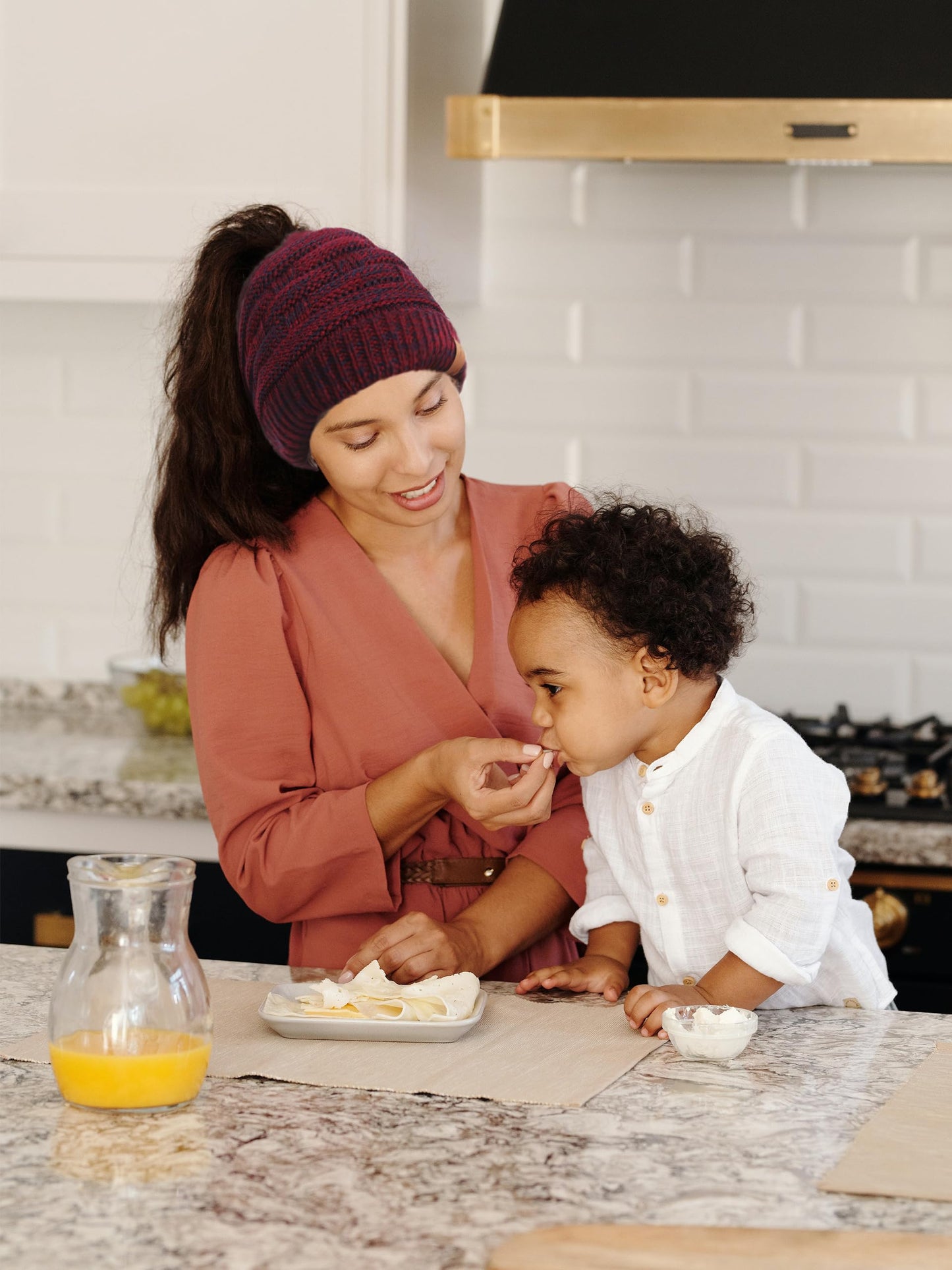 Soul Young Ponytail Messy Bun Beanie Tail Knit Hole Soft Stretch Cable Winter Hat for Women(One Size,Burgendy)